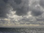 Plane Popping out of the Clouds